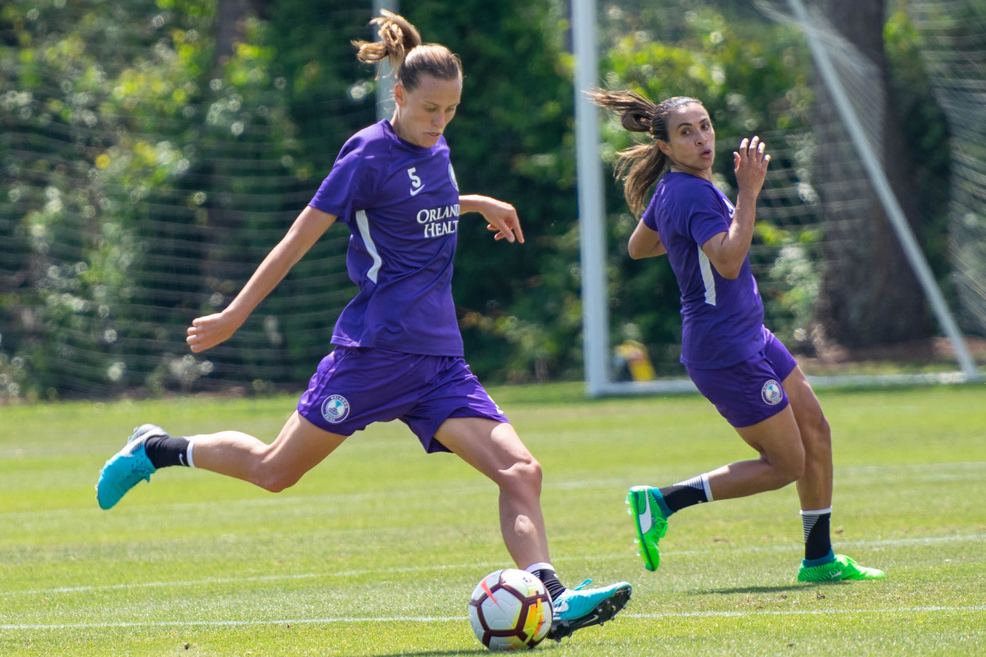 ORLANDO, FL - JULY 07: Orlando Pride forward Marta (10) gets her shot on  goal blocked by Washington Spirit defender Estelle Johnson (24) during the  NWSL soccer match between the Orlando Pride